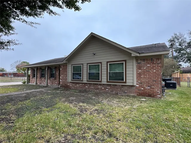 a front view of a house with a garden and porch