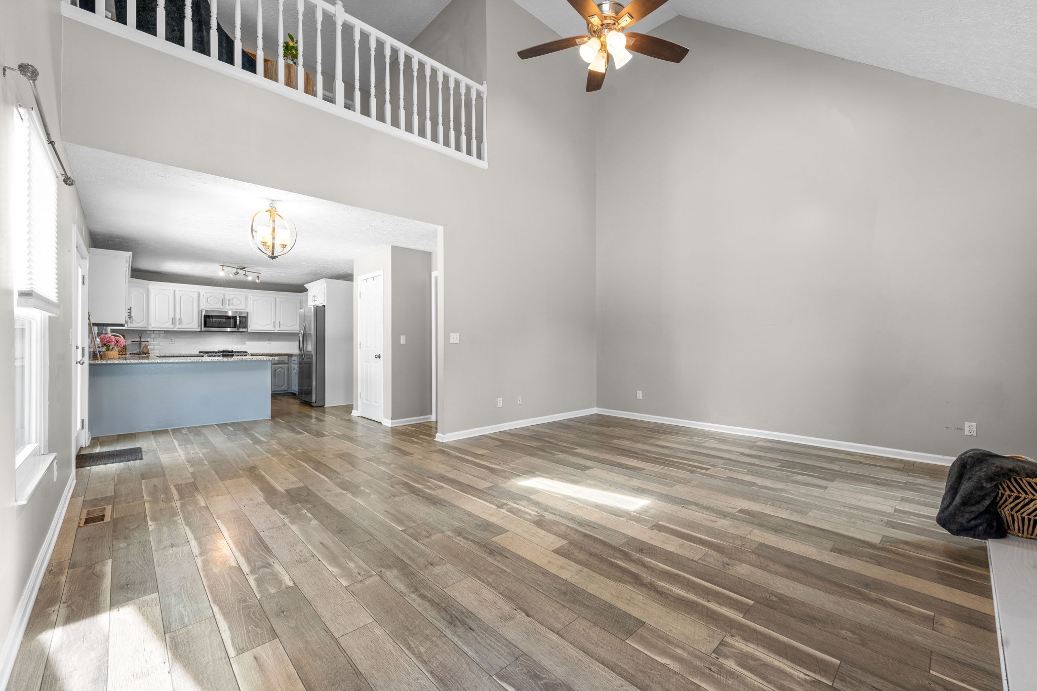 4178 Highway 49 Tennessee Ridge, TN 37178 - Photo 13 of 38 a view of a kitchen with a sink dishwasher a refrigerator with wooden floor