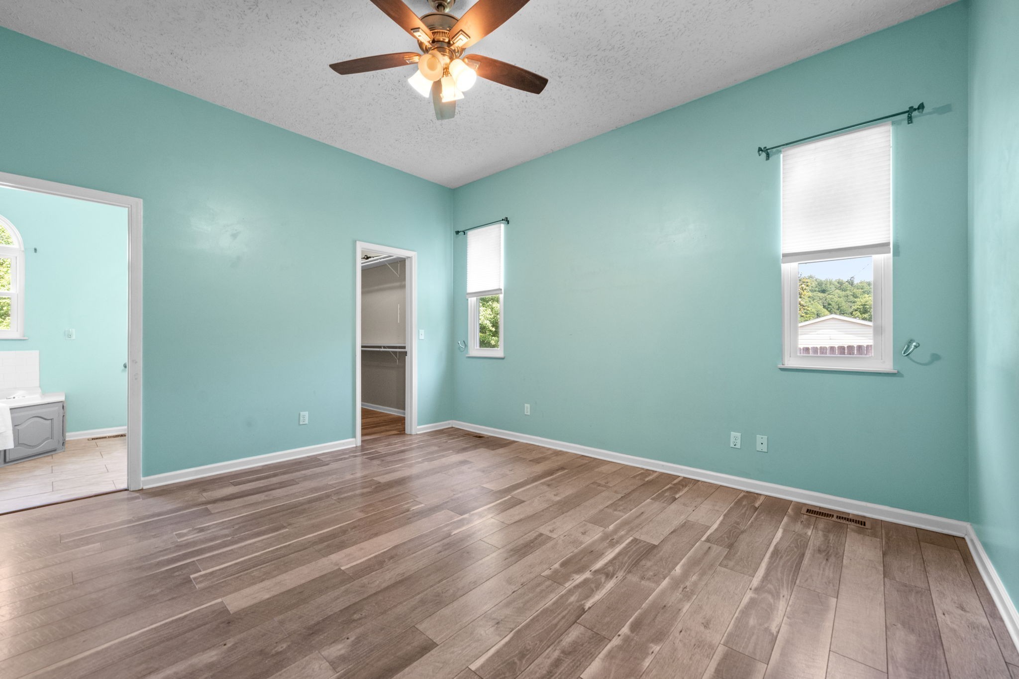 4178 Highway 49 Tennessee Ridge, TN 37178 - Photo 22 of 38 a view of an empty room with wooden floor and a window