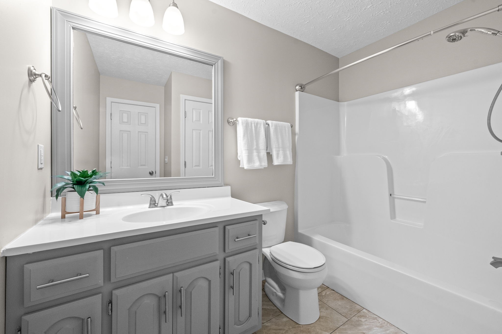 4178 Highway 49 Tennessee Ridge, TN 37178 - Photo 31 of 38 a bathroom with a sink a toilet and shower