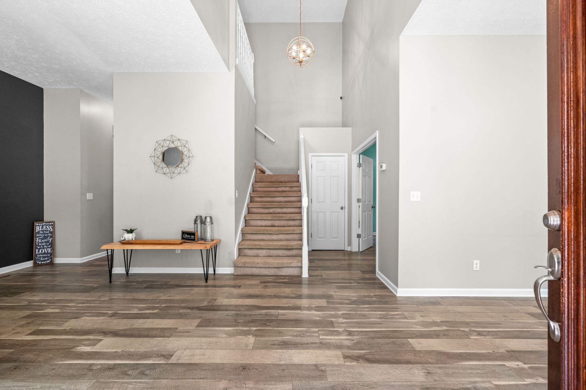 4178 Highway 49 Tennessee Ridge, TN 37178 - Photo 4 of 38 a view of a livingroom with furniture and stairs