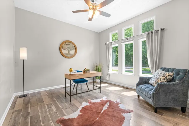 a living room with furniture and a window