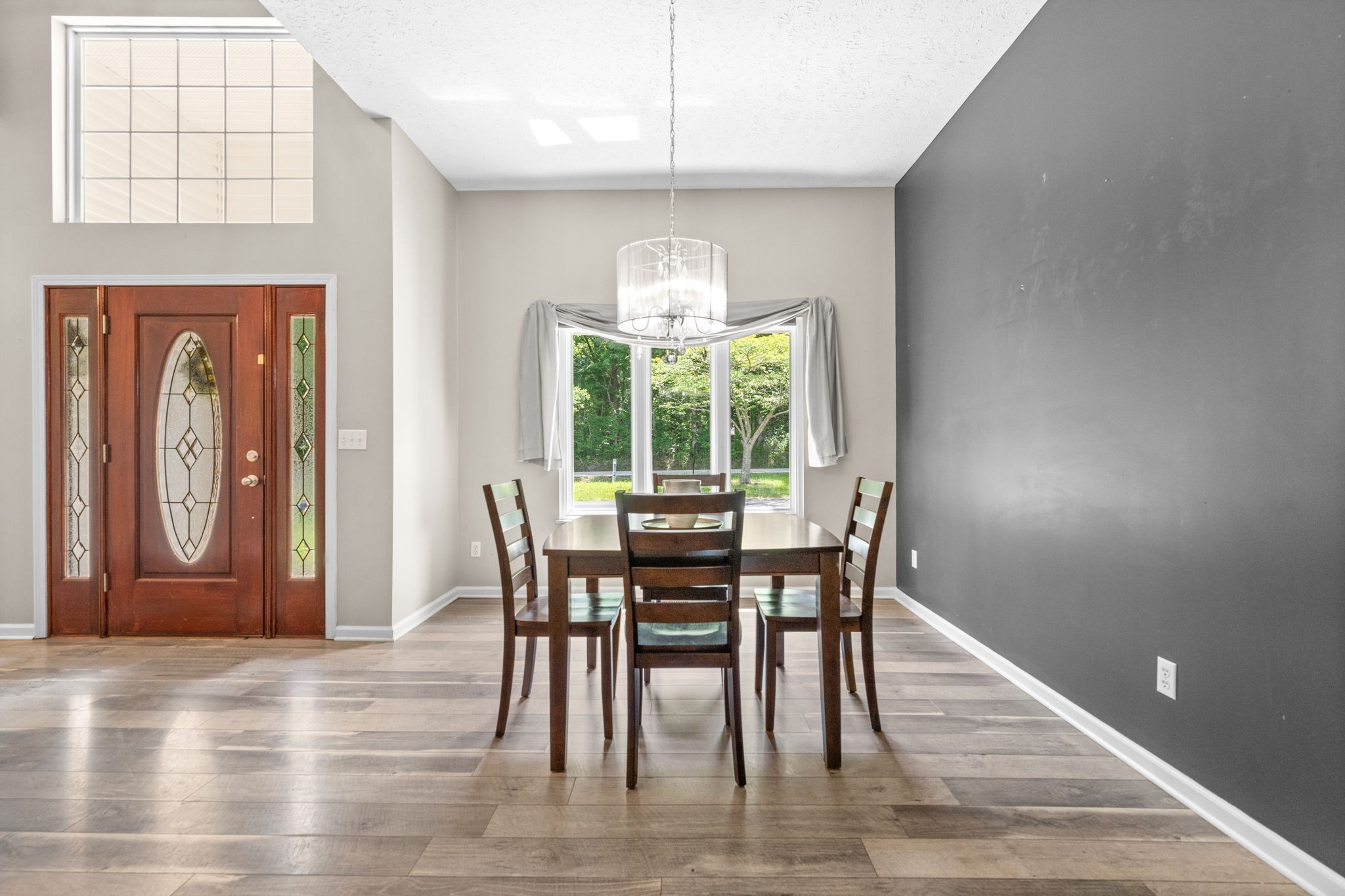 4178 Highway 49 Tennessee Ridge, TN 37178 - Photo 7 of 38 a view of a dining room with furniture window and wooden floor