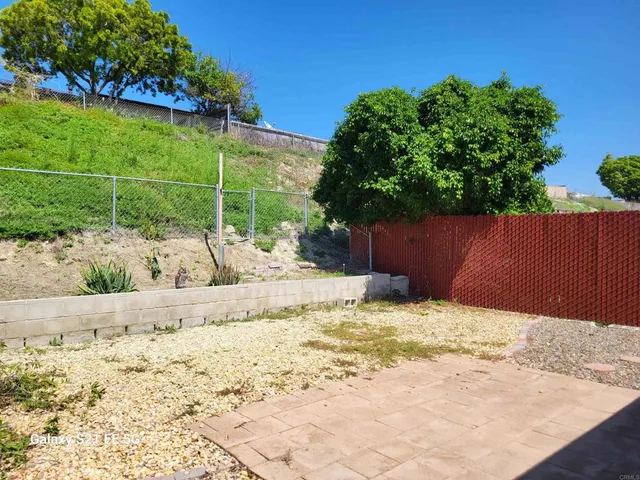 a view of a backyard of the house