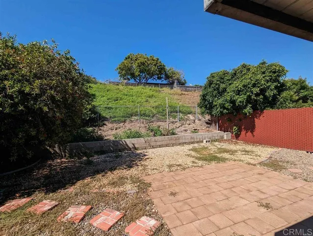 a view of a backyard of the house