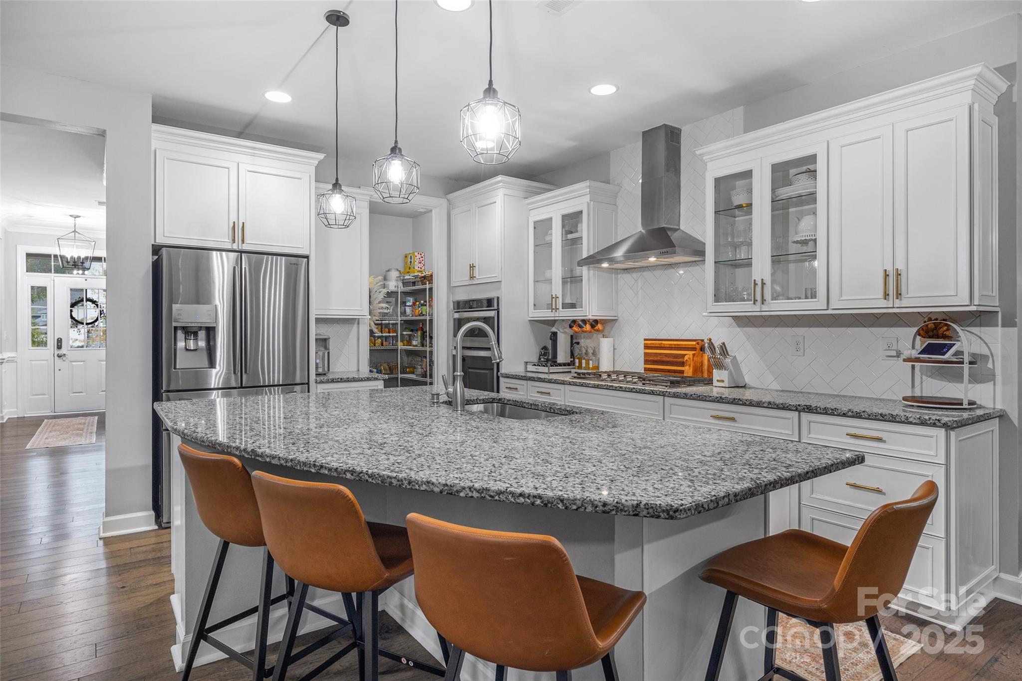 451 Sandbar Point Clover, SC 29710 - Photo 11 of 34 a kitchen with stainless steel appliances granite countertop a table chairs sink refrigerator and microwave