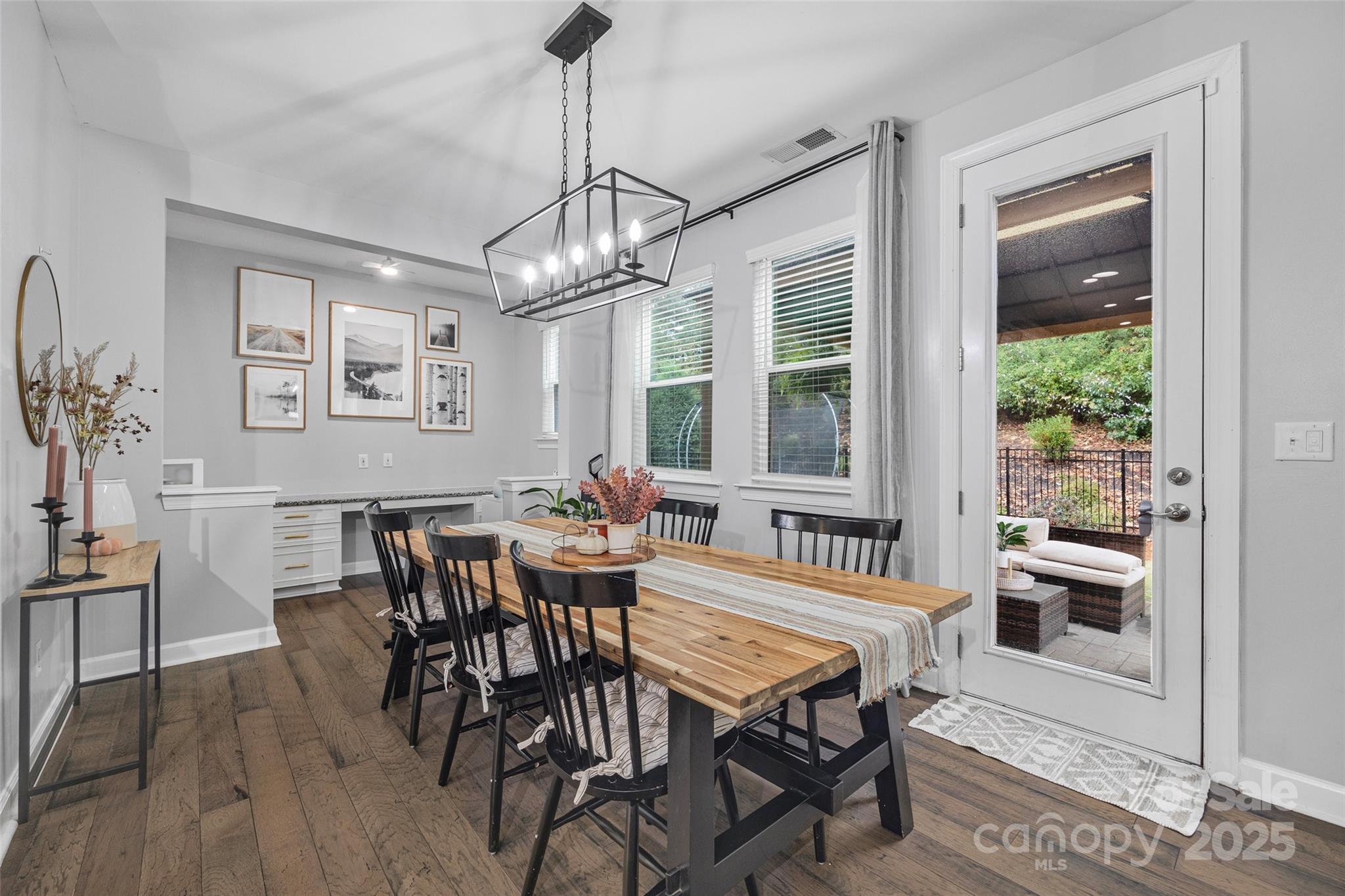 451 Sandbar Point Clover, SC 29710 - Photo 15 of 34 a dining room with furniture a chandelier and wooden floor