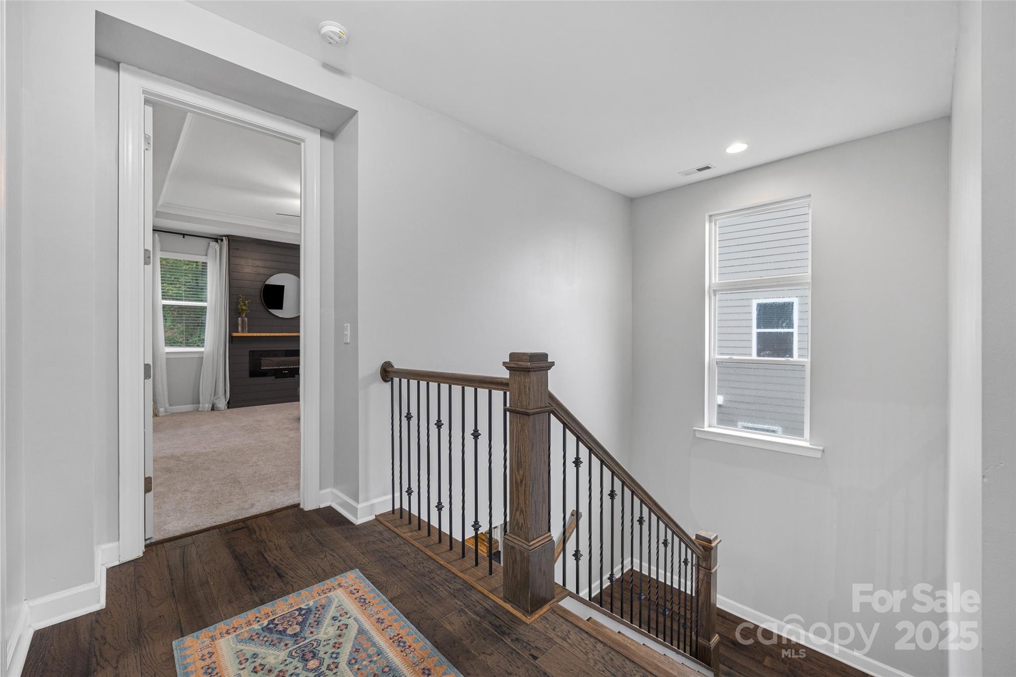 451 Sandbar Point Clover, SC 29710 - Photo 16 of 34 a view of a hallway with wooden floor and a livingroom