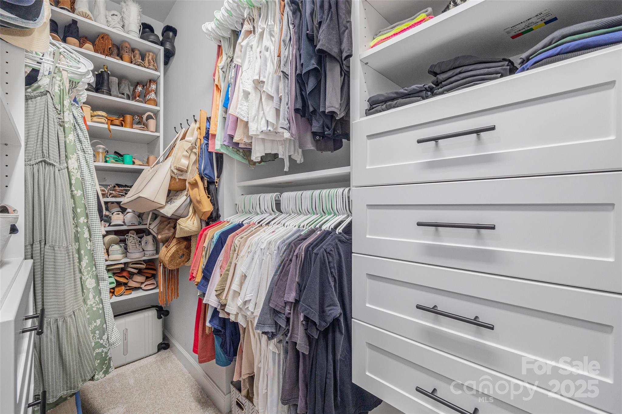 451 Sandbar Point Clover, SC 29710 - Photo 20 of 34 a view of walk in closet with clothes and shoes