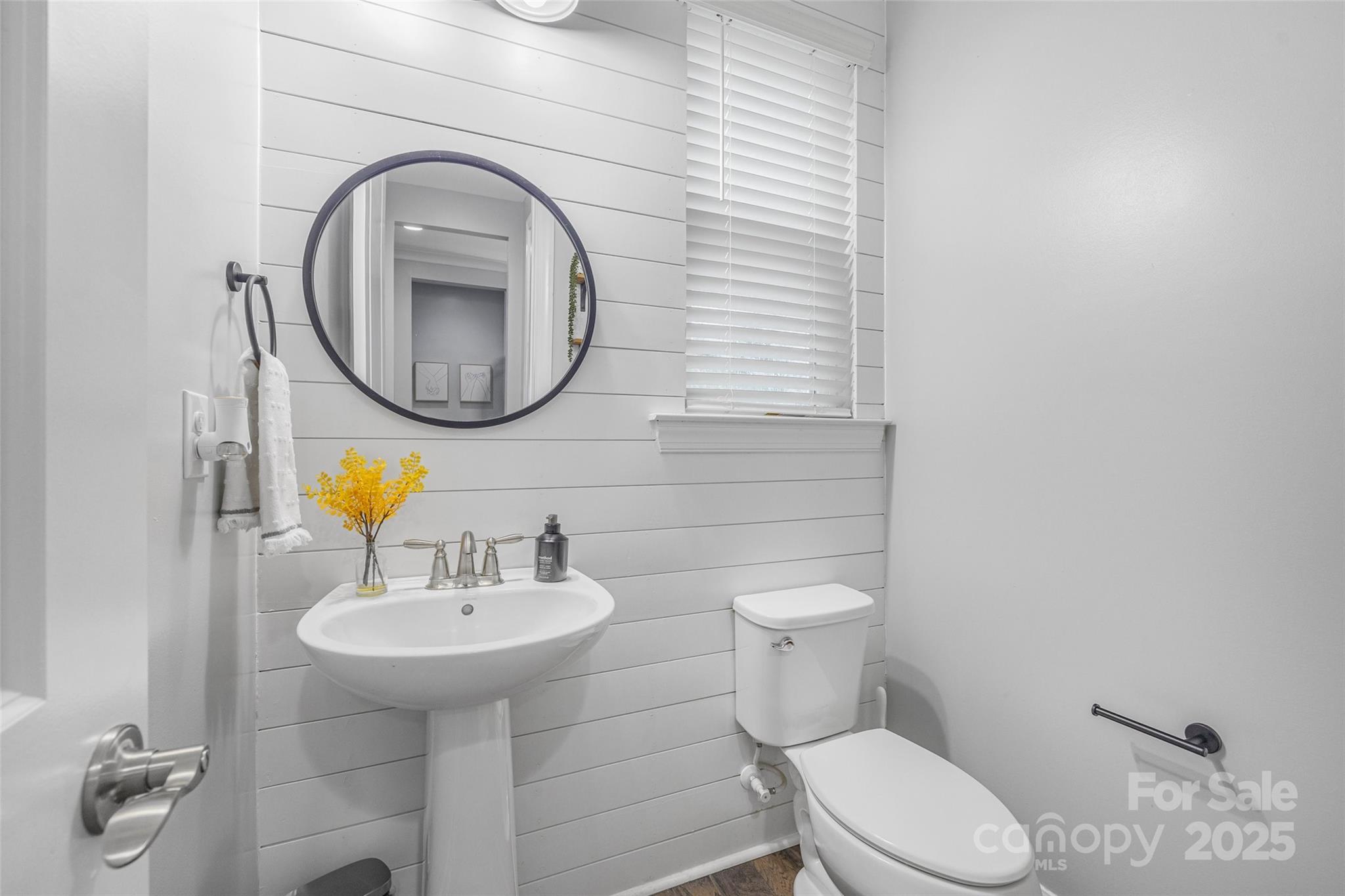 451 Sandbar Point Clover, SC 29710 - Photo 7 of 34 a bathroom with a sink a toilet and a mirror