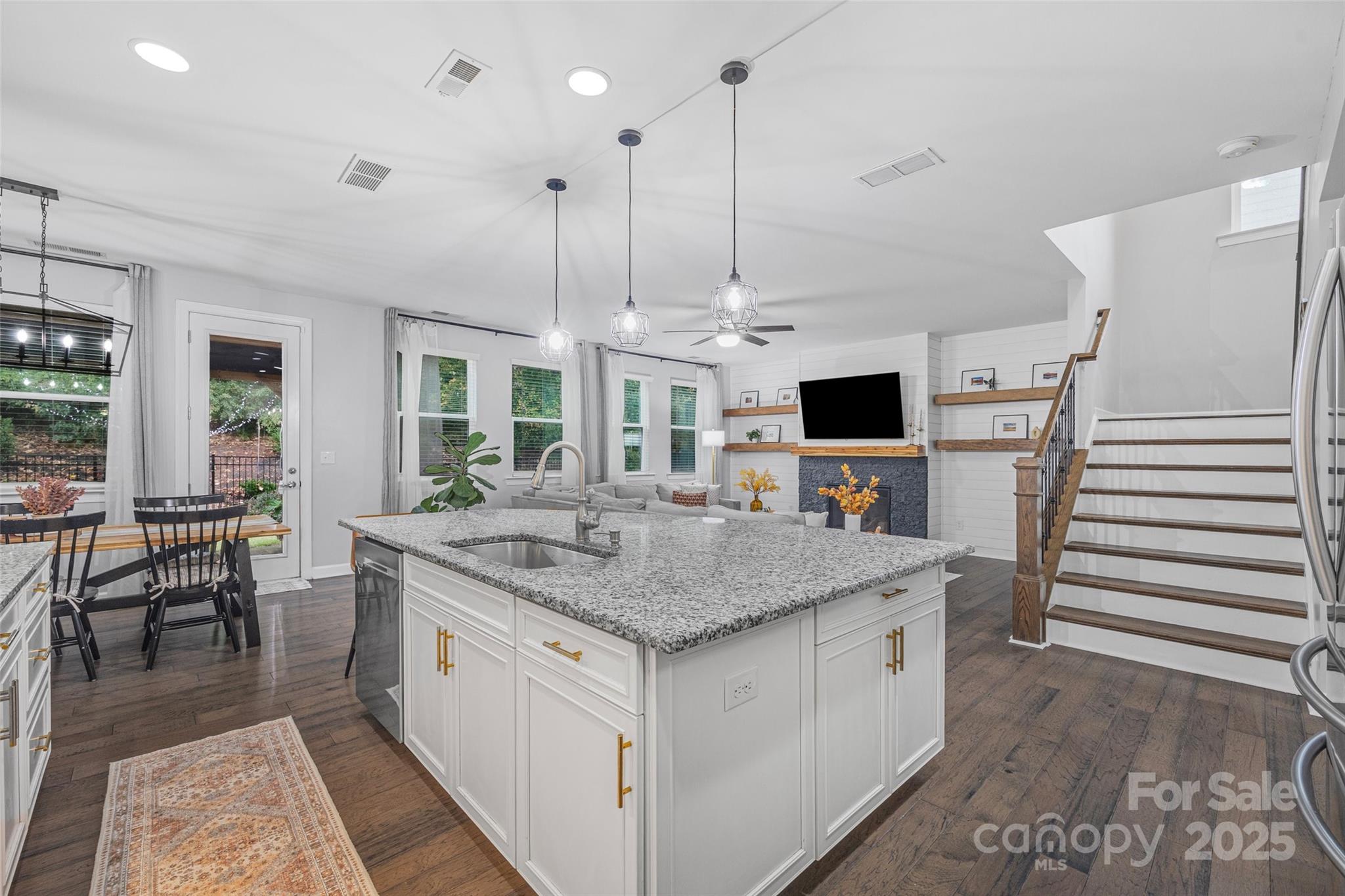 451 Sandbar Point Clover, SC 29710 - Photo 10 of 34 a kitchen with stainless steel appliances granite countertop a stove and refrigerator
