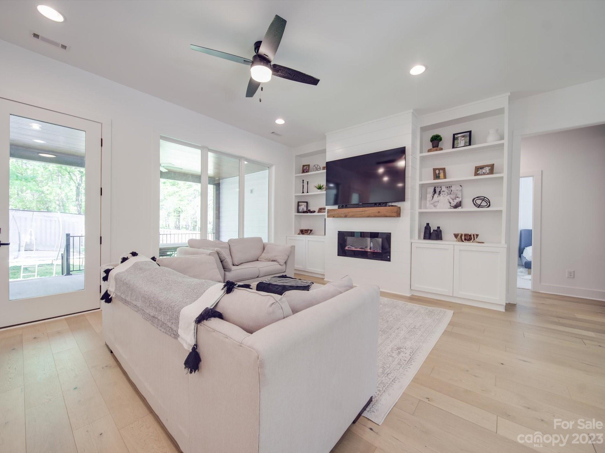 626 Deese Road Monroe, NC 28110 - Photo 13 of 41 a living room with furniture fireplace and flat screen tv