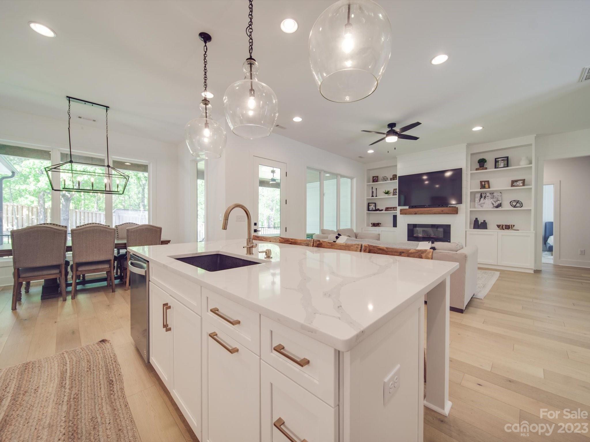 626 Deese Road Monroe, NC 28110 - Photo 17 of 41 a large kitchen with kitchen island a large island in it