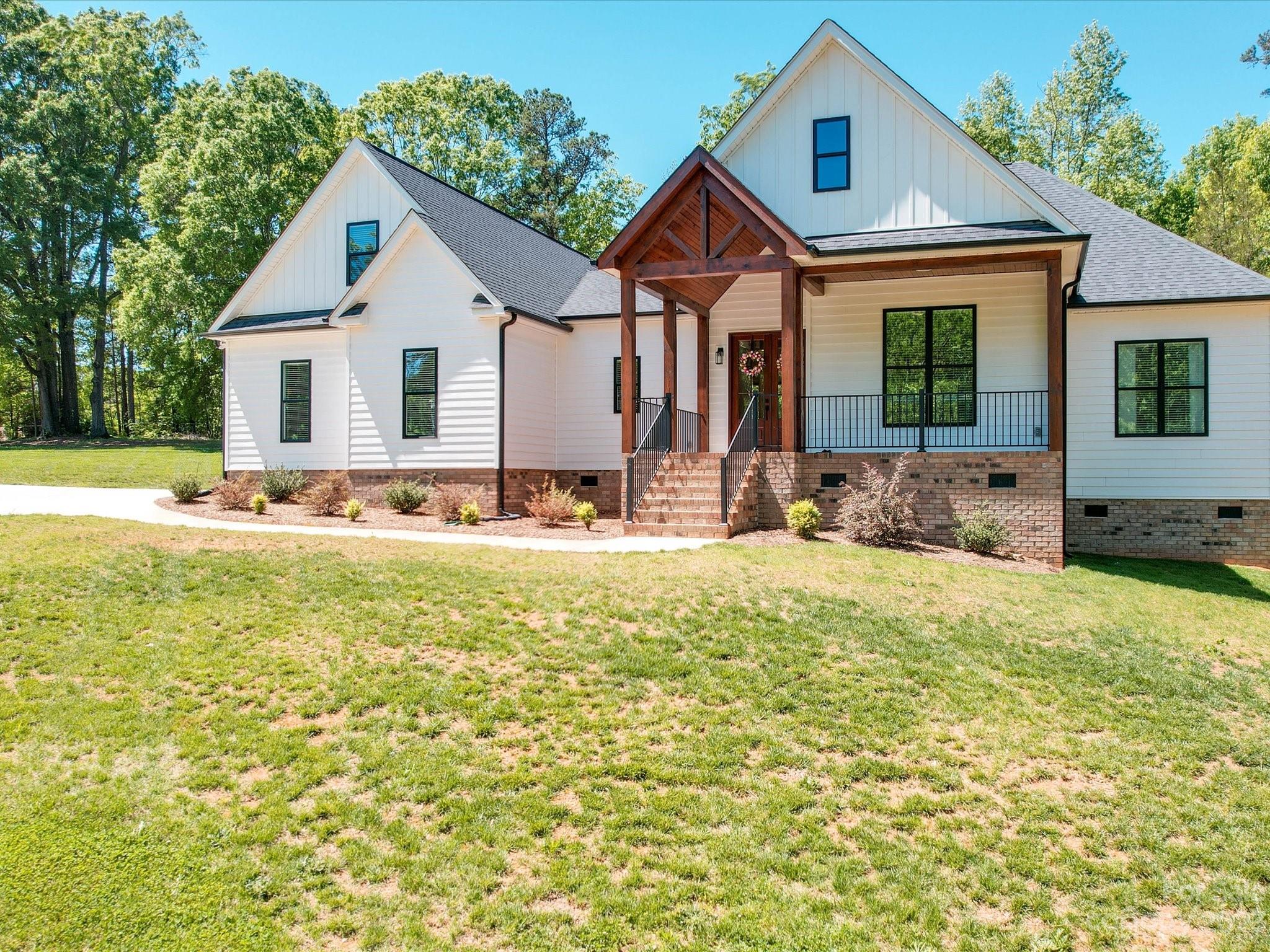626 Deese Road Monroe, NC 28110 - Photo 2 of 41 a front view of a house with a yard
