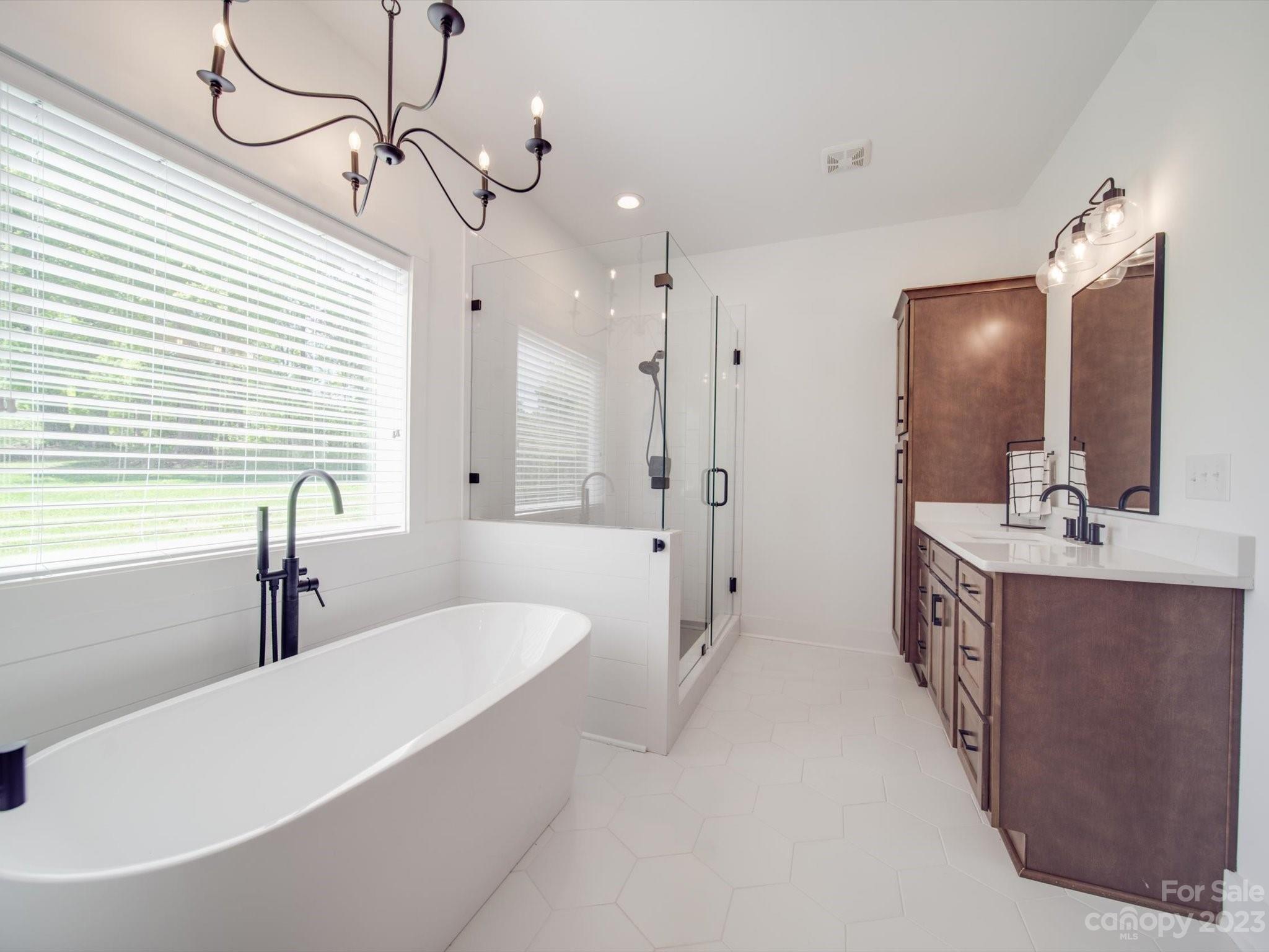 626 Deese Road Monroe, NC 28110 - Photo 27 of 41 a spacious bathroom with a double vanity sink mirror and bathtub