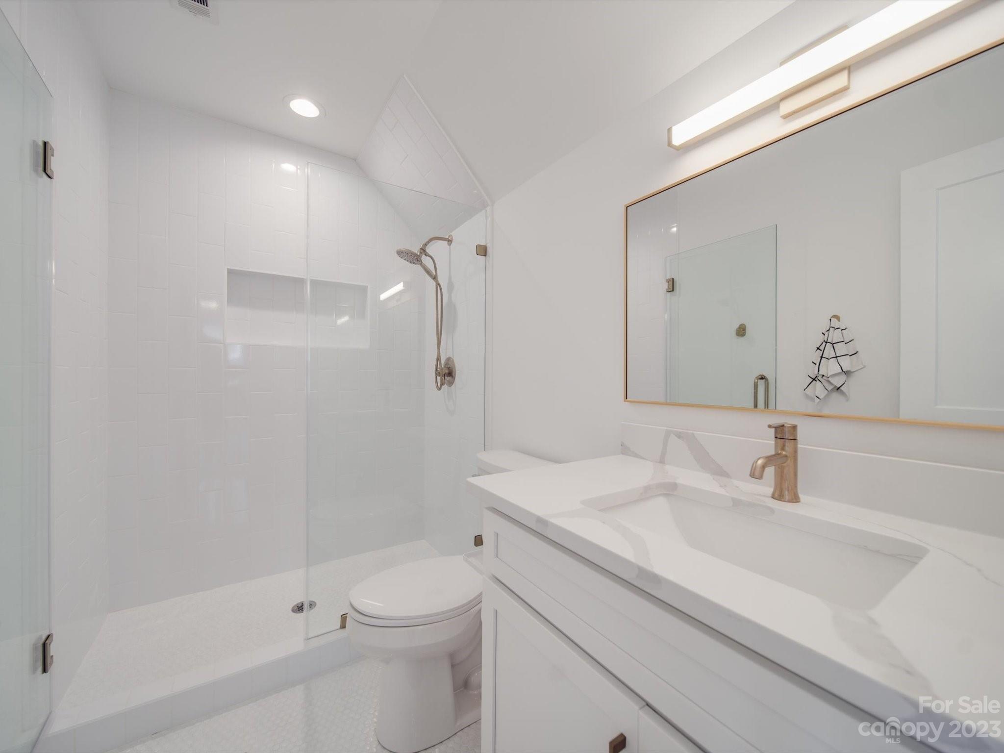 626 Deese Road Monroe, NC 28110 - Photo 31 of 41 a bathroom with a sink a toilet and shower