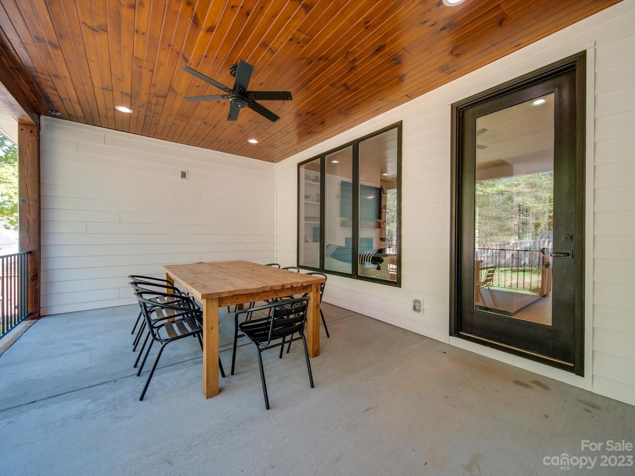 626 Deese Road Monroe, NC 28110 - Photo 4 of 41 a dining room with furniture and a floor to ceiling window