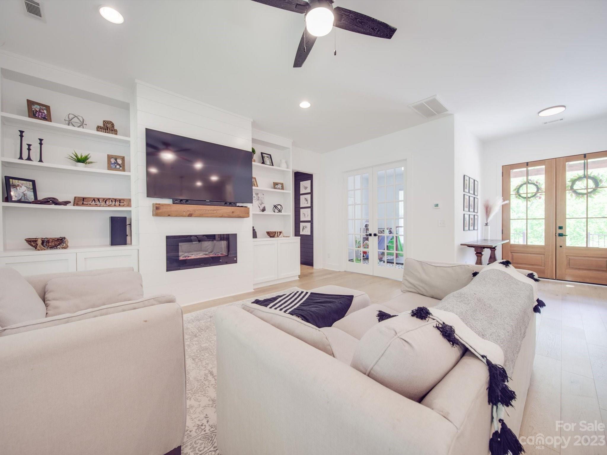 626 Deese Road Monroe, NC 28110 - Photo 10 of 41 a living room with furniture and a flat screen tv