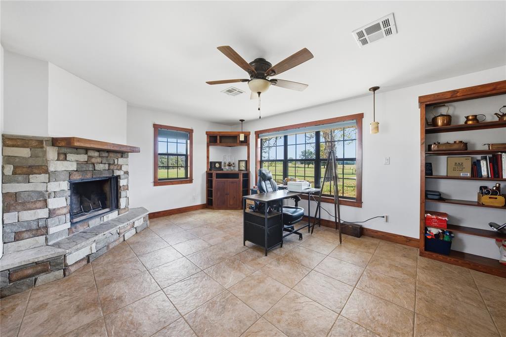 12985 County Road 4331 Larue, TX 75770 - Photo 12 of 23 a living room with furniture and a fireplace