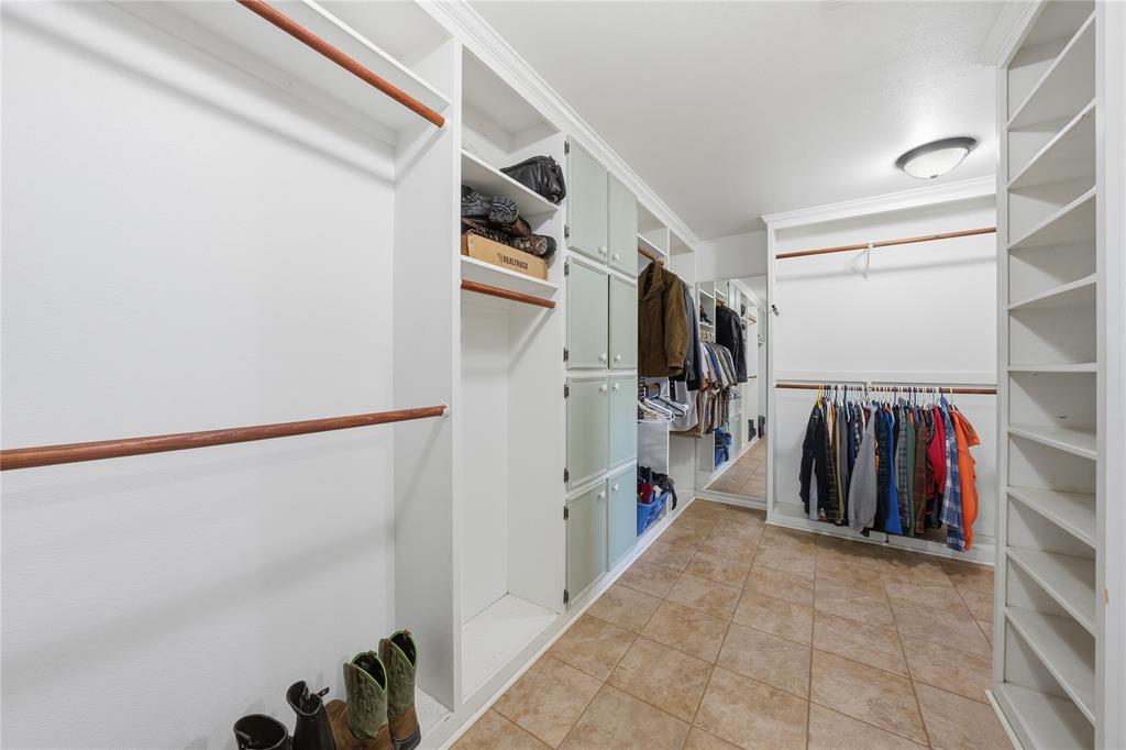 12985 County Road 4331 Larue, TX 75770 - Photo 16 of 23 a view of walk in closet with clothes and shoes