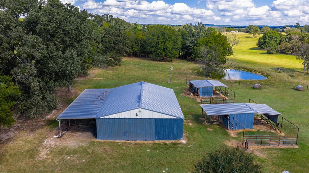 12985 County Road 4331 Larue, TX 75770 - Photo 4 of 23 a view of a yard with table and chairs under an umbrella