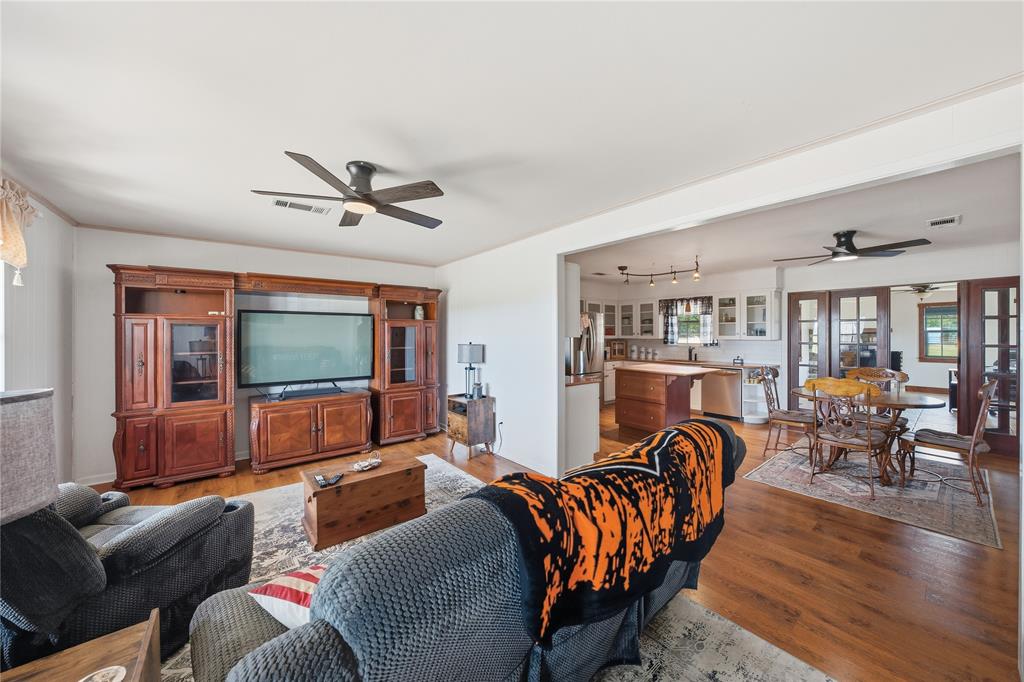 12985 County Road 4331 Larue, TX 75770 - Photo 9 of 23 a living room with furniture ceiling fan and a flat screen tv