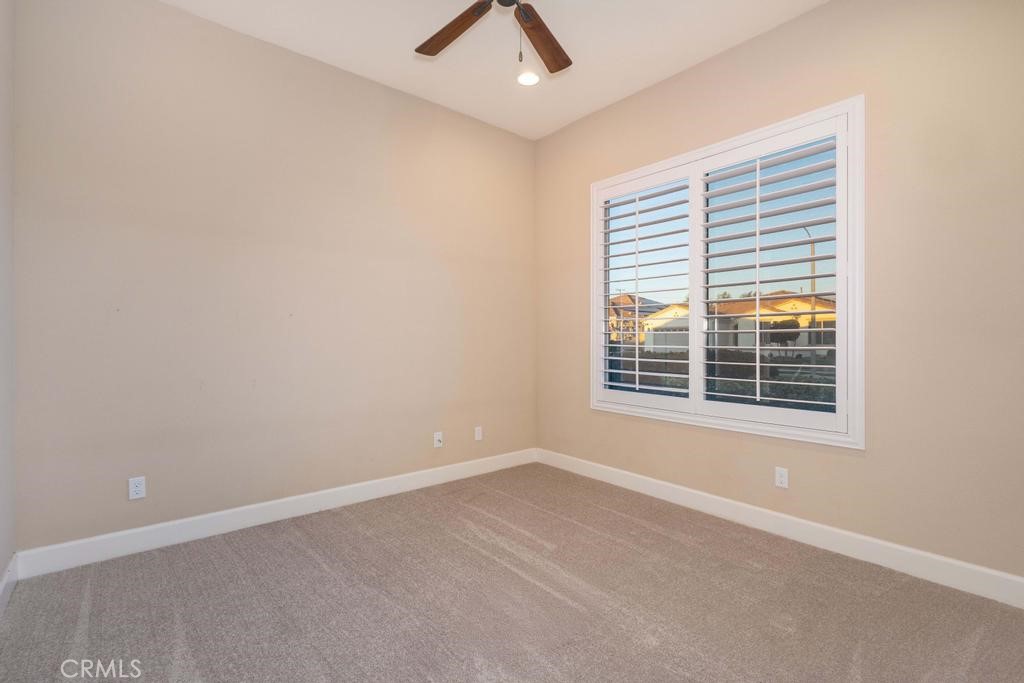 1647 Via Rojas Hemet, CA 92545 - Photo 11 of 29 an empty room with a window and ceiling fan