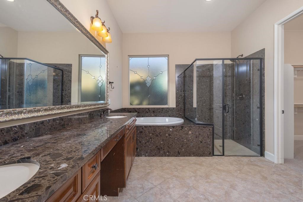 1647 Via Rojas Hemet, CA 92545 - Photo 17 of 29 a bathroom with a granite countertop double vanity sink and mirror