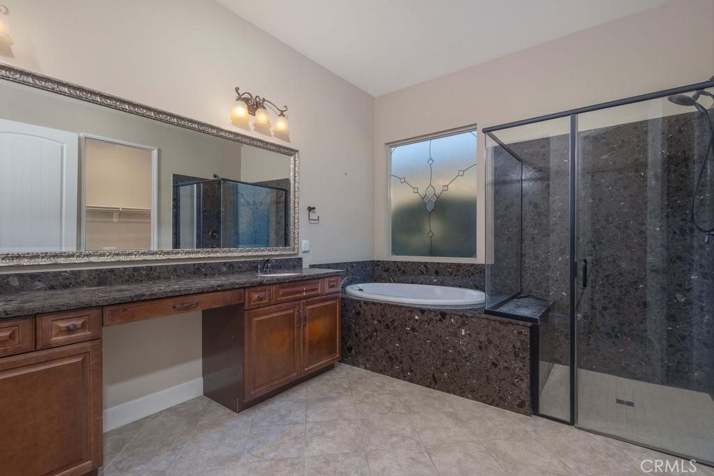 1647 Via Rojas Hemet, CA 92545 - Photo 19 of 29 a bathroom with a granite countertop sink a mirror and a bathtub