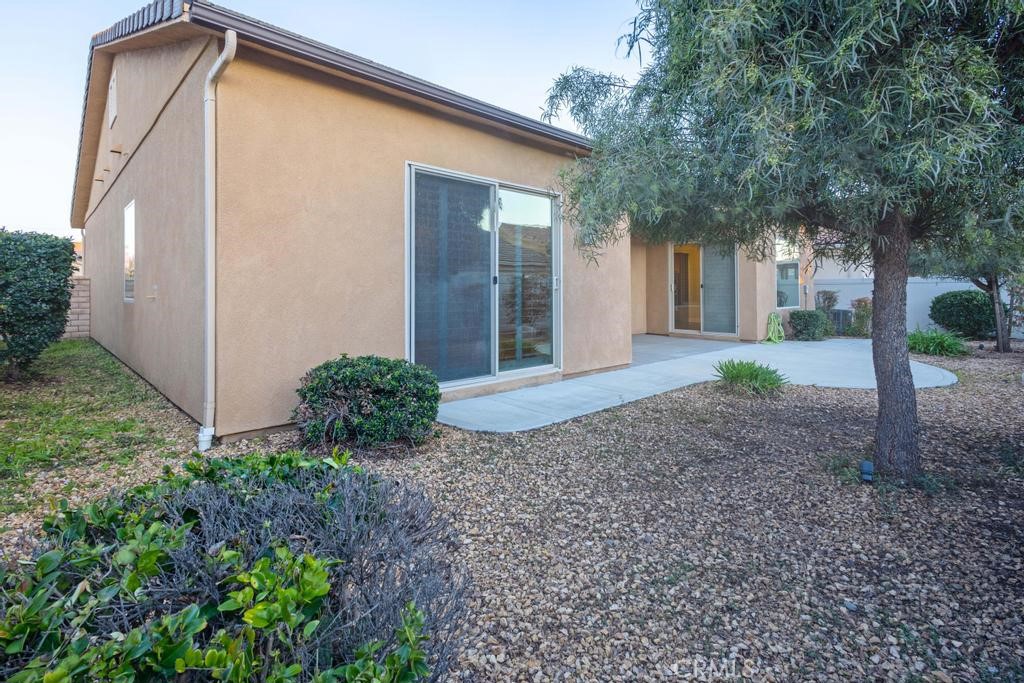 1647 Via Rojas Hemet, CA 92545 - Photo 27 of 29 a view of a house with backyard and trees