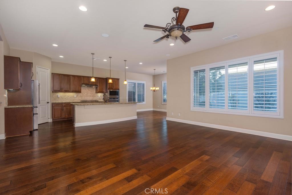 1647 Via Rojas Hemet, CA 92545 - Photo 4 of 29 a view of a big room with wooden floor and a kitchen