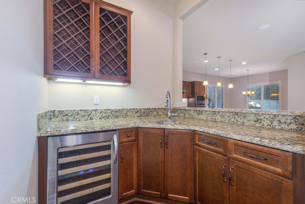 1647 Via Rojas Hemet, CA 92545 - Photo 7 of 29 a bathroom with a granite countertop sink and a mirror