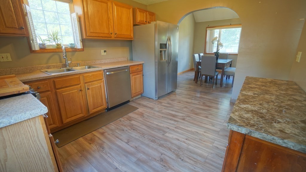 142 Avery Street Springfield, MA 01119 - Photo 12 of 27 a kitchen with sink cabinets and wooden floor