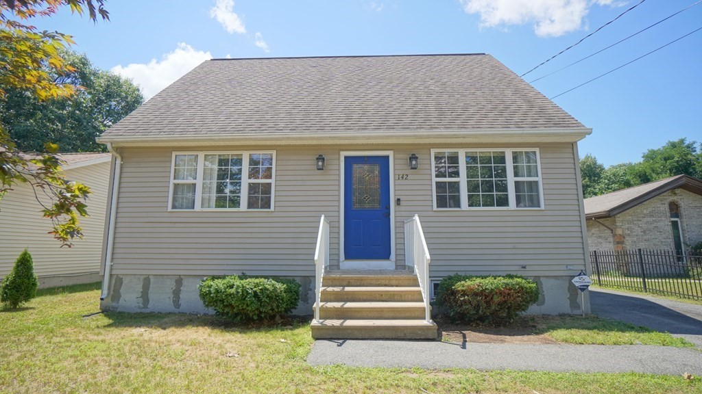 142 Avery Street Springfield, MA 01119 - Photo 3 of 27 a front view of a house with a yard