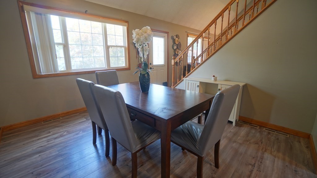142 Avery Street Springfield, MA 01119 - Photo 5 of 27 a view of a dining room with furniture and wooden floor
