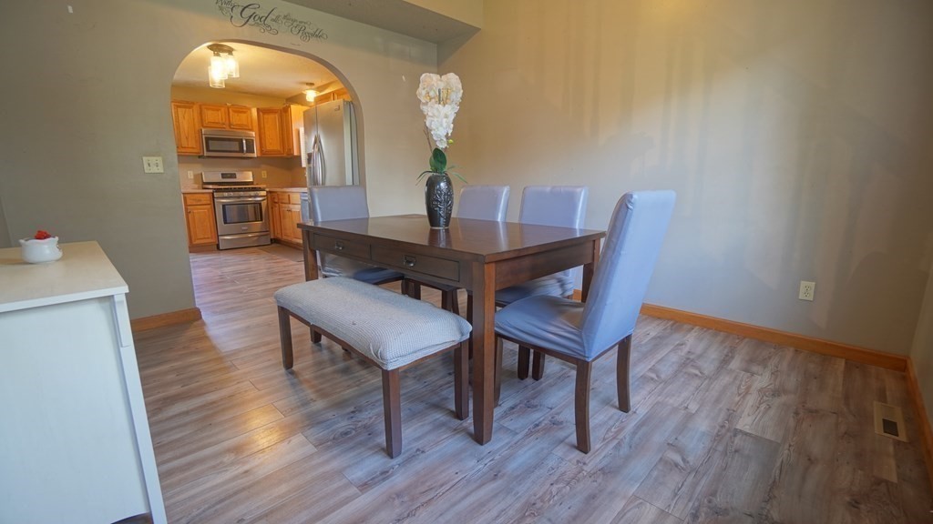 142 Avery Street Springfield, MA 01119 - Photo 6 of 27 a view of a dining room with furniture and wooden floor