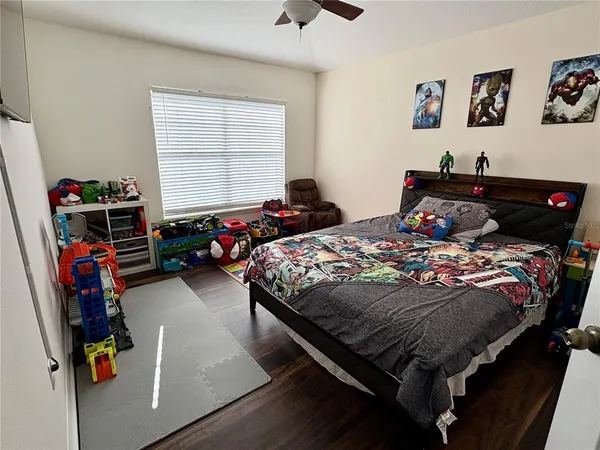 a bedroom with bed and a window