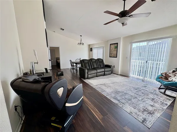 a living room with furniture and a rug