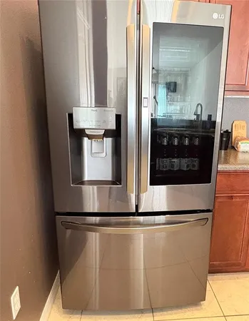 a view of a refrigerator in kitchen