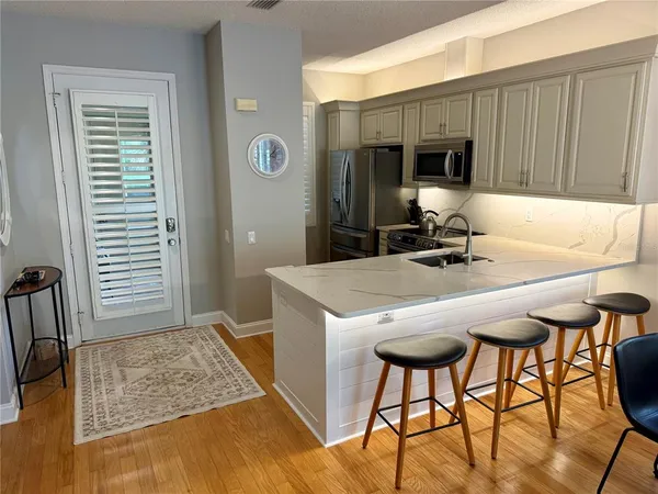 a kitchen with a table and chairs