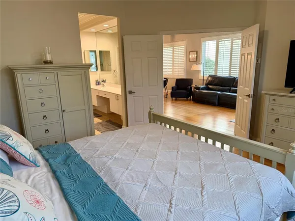 a bedroom with a bed and furniture