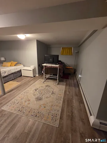 a spacious bedroom with a bed and a table