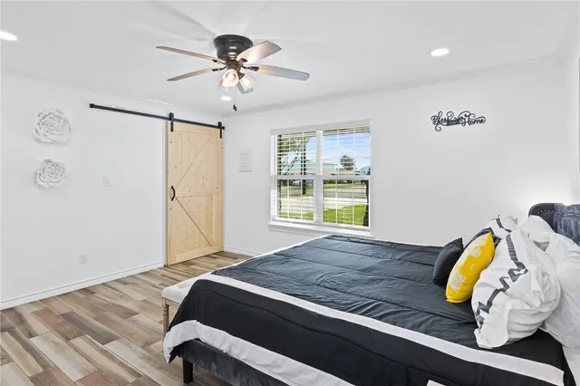 a bedroom with furniture and windows