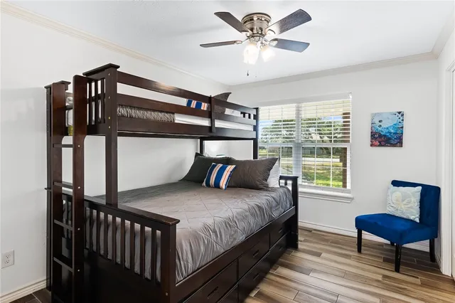 a view of a backyard with wooden fence