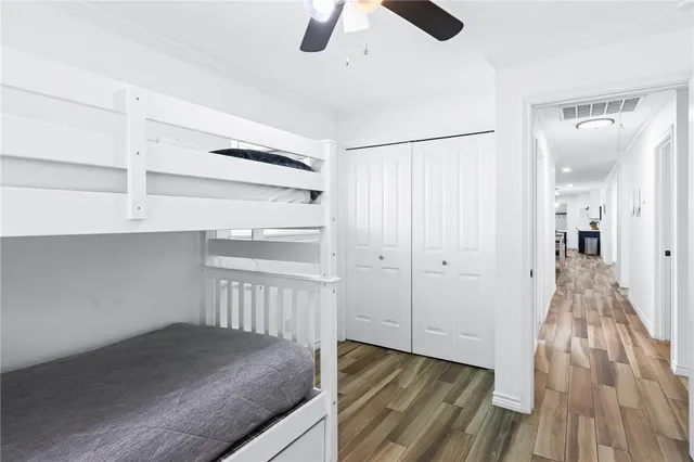 an aerial view of residential houses with outdoor space and lake view