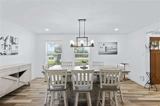 a bedroom with a bed window and a table