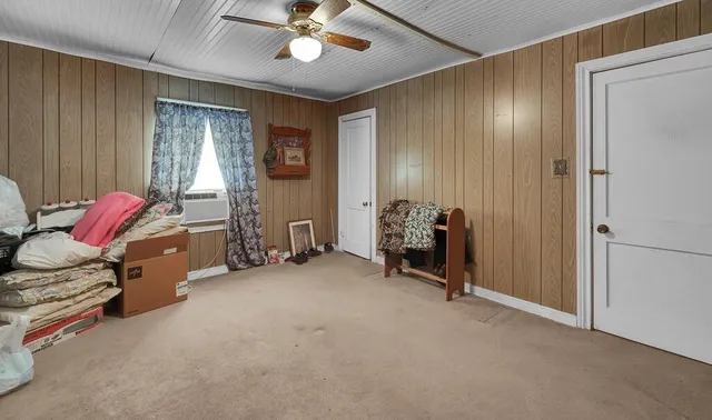 a view of a room with gym equipment and a large window