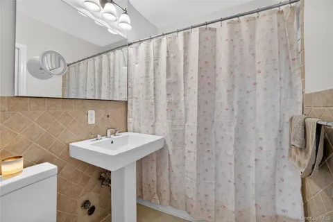 a bathroom with a sink a mirror and a toilet
