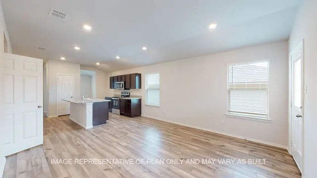 a view of kitchen with wooden floor