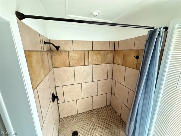 a bathroom with a toilet a sink and a mirror